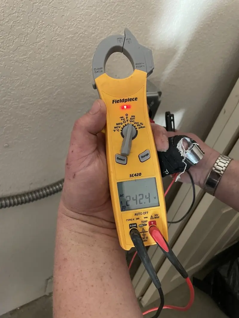Voltage testing with clamp meter during Generator Installation in Artondale